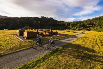 2 bikers at the summit of the Rail Trail Section on the Remutaka Cycle Trail.