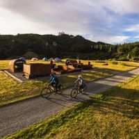 2 bikers at the summit of the Rail Trail Section on the Remutaka Cycle Trail.