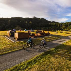 2 bikers at the summit of the Rail Trail Section on the Remutaka Cycle Trail.