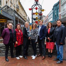 7 members of the WellingtonNZ board pictured in front of the Cuba Street bucket Fountain.