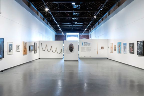 Interior of the New Zealand Portrait Gallery Te Pūkenga Whakaata in Wellington, featuring portrait artworks displayed along white gallery walls in a spacious exhibition hall.