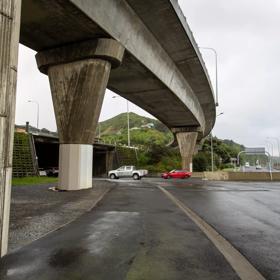 The urban setting of the Hutt Road Ngauranga Interchange, where highways got over tunnels with walls that once had graffiti.