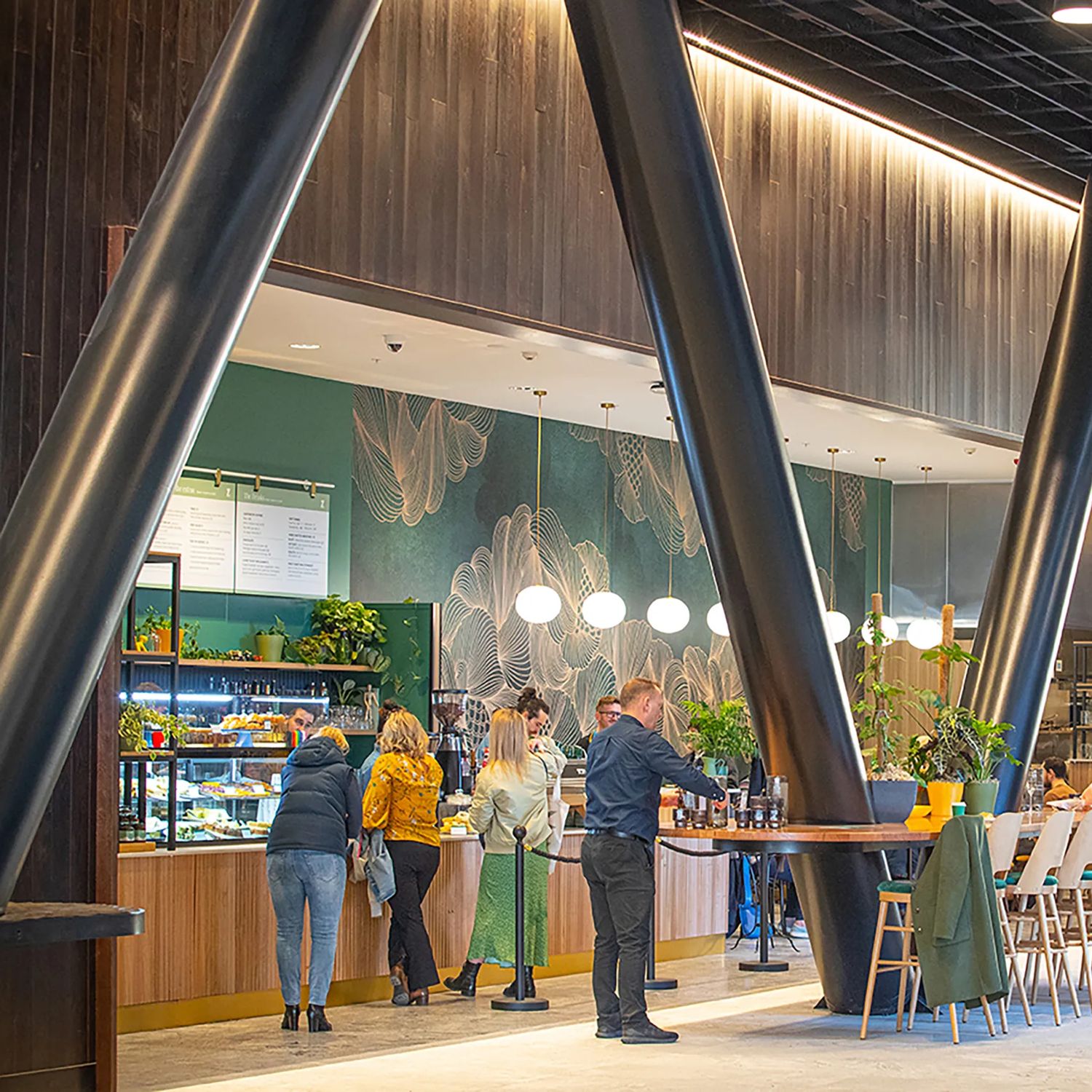 A photo of people ordering at and eating in Zephyr Cafe in Wellington