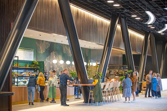 A photo of people ordering at and eating in Zephyr Cafe in Wellington