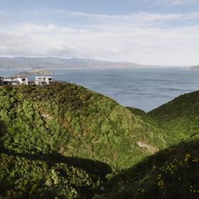 The view from Te Ara Paparāngi ki te Tonga over the Newlands hills out to the Wellington Harbour and Eastbourne.