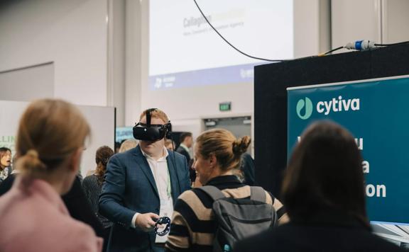 A person is using virtual reality goggles at the LIfe Sciences Summit at Shed 6 in Wellington.