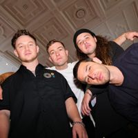 Four members of the Drax Project posing for the camera