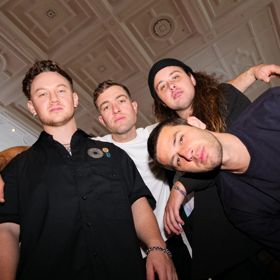 Four members of the Drax Project posing for the camera