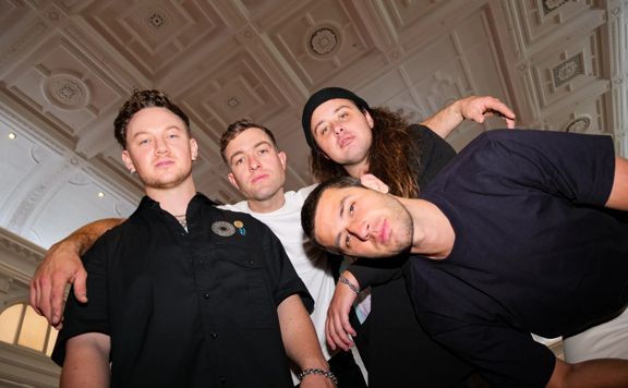 Four members of the Drax Project posing for the camera