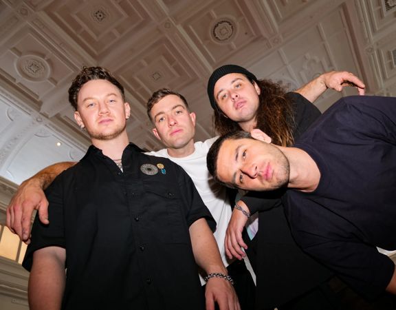 Four members of the Drax Project posing for the camera