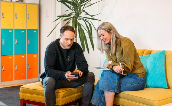 Kin recruitment and Storypark networking, collaborating in modern office space.