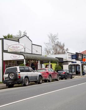 The screen location of Greytown, a historic small town featuring Victorian buildings,  stables, colonial cottages, and rural landscapes surrounding.