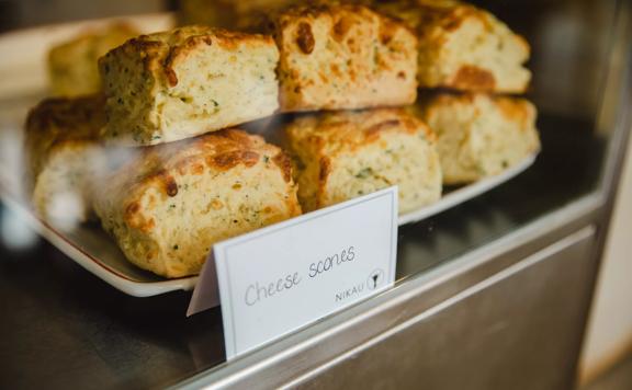 A plate of cheese scones in the pastry window at Nikau Café, a caféin the City Gallery Wellington located in Te Ngākau Civic Square.