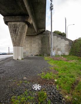 The urban setting of the Hutt Road Ngauranga Interchange, where highways got over tunnels with walls that once had graffiti.