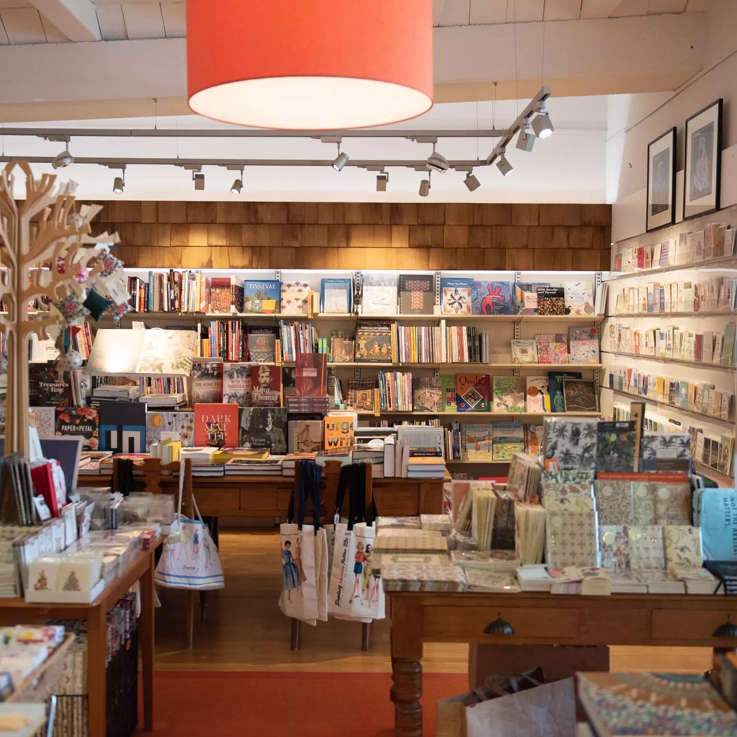 Inside Minerva, a book store with wooden decorations around the room.