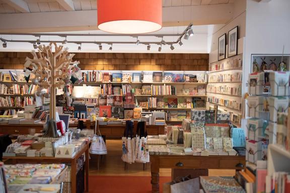 Inside Minerva, a book store with wooden decorations around the room.