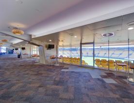 The large open space of the Sky Stadium Function centre  members clubroom looking over the field and stands.