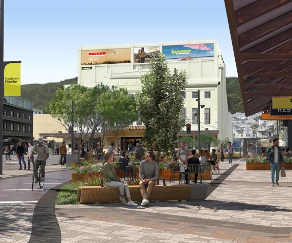 A render image of Courtenay Place looking towards the Embassy Theatre building, showing improved pedestrian access and a bike lane.