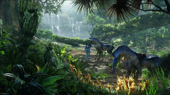 A still image from the 'Avatar' movie shows lush green forest and blue direhorses next to the Na'vi.