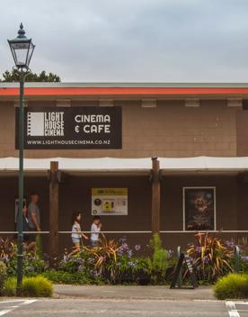 The brown and red exterior of Lighthouse Cinema Pāuatahanui.