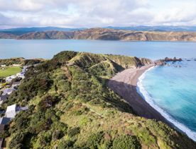 A drone shot of the Eastern Walkway with a view of Breaker Bay.