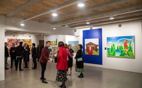 The interior of Webb's Wellington Conference Venue where people are gathered for an art exhibition. 