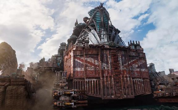 A still from the ‘Mortal Engines’ movie. Three of the engines in a row, the middle engine has the Union Jack on the front.