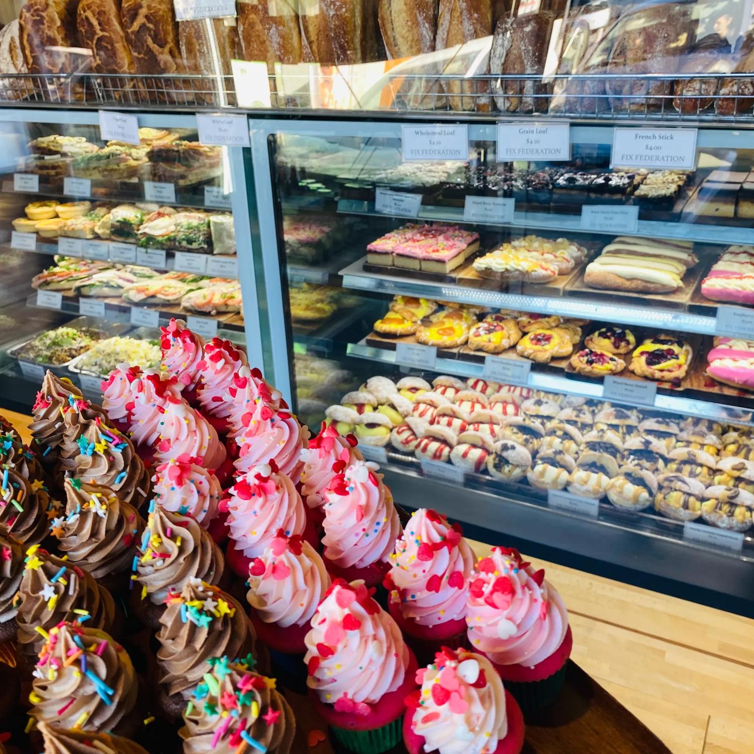 Cupcakes and other sweet treats inside the cabinet at Fix Federation.