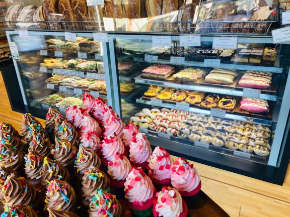 Cupcakes and other sweet treats inside the cabinet at Fix Federation.