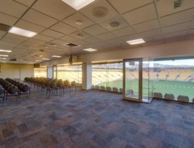 Level 3 east and west lounges of the Hnry Stadium Function Centre, looking through large windows at the field below.