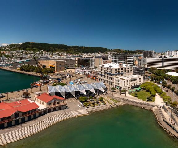 Aerial view of Wellington showing the waterfront and buildings such as Te Papa, Tākina, and the Boatshed.