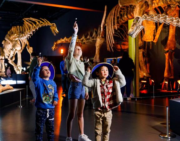 3 young children visit the Dinosaurs of Patagonia in Perth.