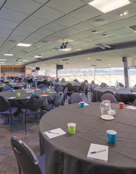 15 large tables in the members lounge and Hnry Stadium Function Centre, each table has 6 chairs, a black table cloth, notepads and water.