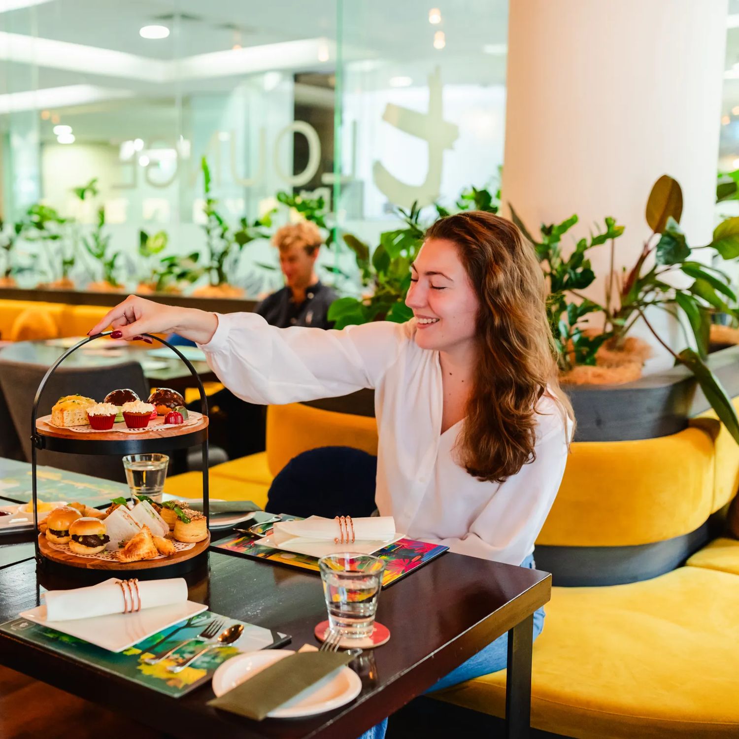 People enjoy high tea at t-Lounge by Dilmah.