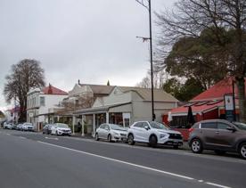 The screen location of Greytown, a historic small town featuring Victorian buildings,  stables, colonial cottages, and rural landscapes surrounding.