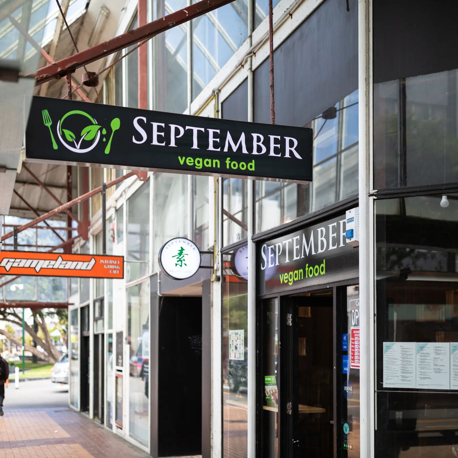 The 'September vegan food' sign above the Manners Street sidewalk in Te Aro Wellington.