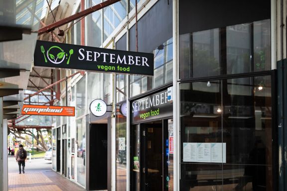 The 'September vegan food' sign above the Manners Street sidewalk in Te Aro Wellington.