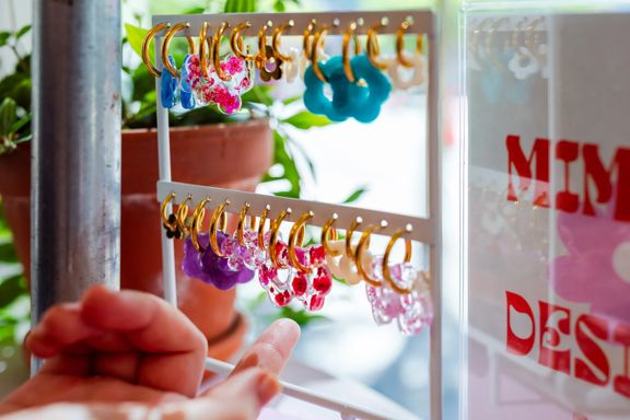 Colourful hoop earrings displayed on a jewellery stand at Preloved Charlies.