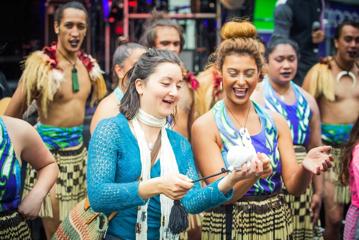 A group of dancers perform a Haka at the CubaDupa street festival.