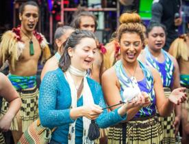 A group of dancers perform a Haka at the CubaDupa street festival.