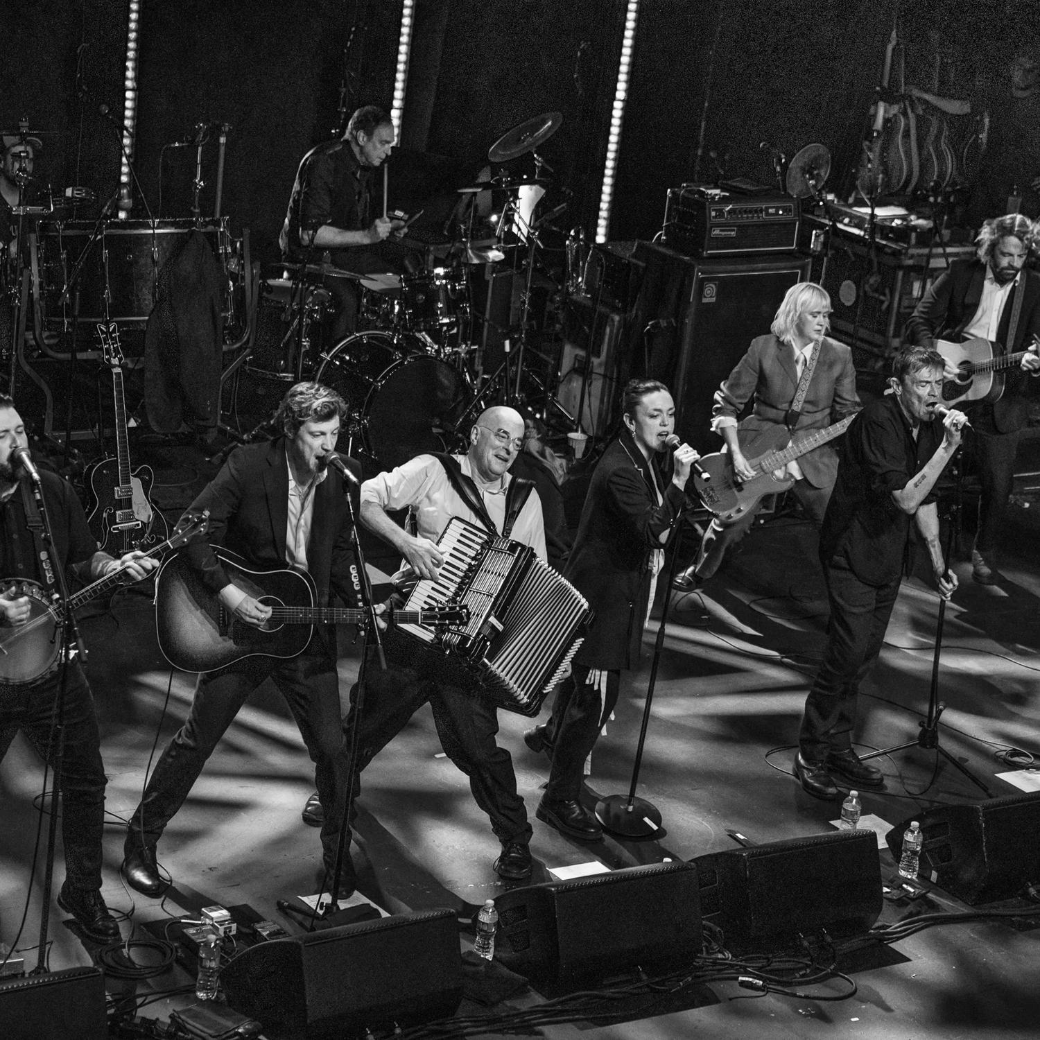 The Pogues perform on stage.