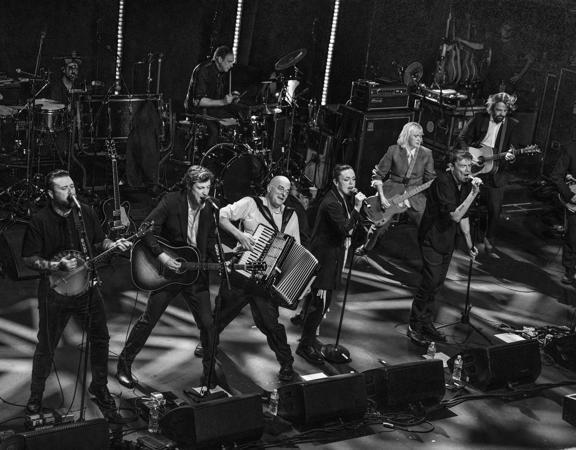 The Pogues perform on stage.