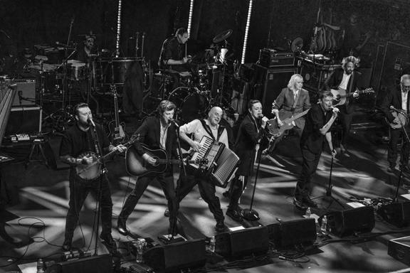 The Pogues perform on stage.