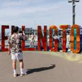 Family taking a photo with the Wellington sign.