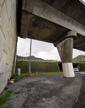 The urban setting of the Hutt Road Ngauranga Interchange, where highways got over tunnels with walls that once had graffiti.