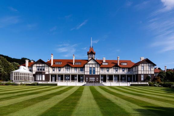 The exterior and lawn of the Government House in Wellington.