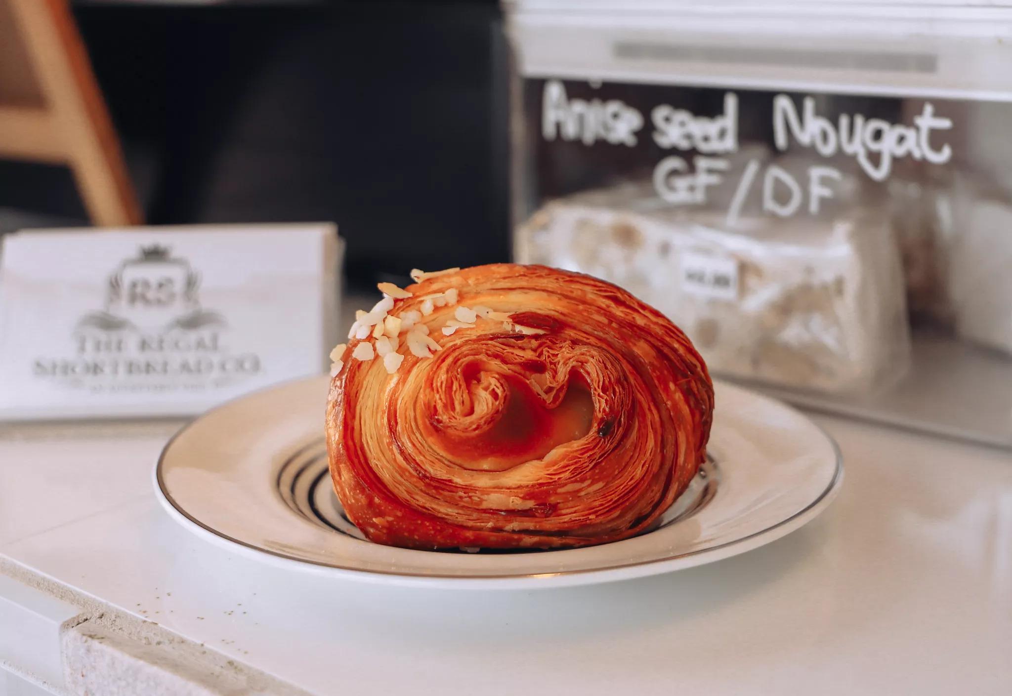 A croissant on a plate at regal Shortbread Co in Porirua.