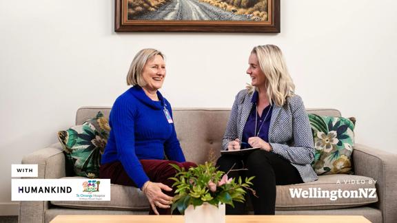 Kalyn Ponti from Humankind and Biddy Harford of Te Omanga Hospice sitting on a couch talking with eachother.