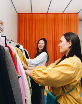 Two people are shopping at Sully's.