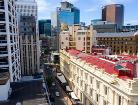 The mix of modern and old buildings along Lambton Quay, including the old supreme court, and old bank.
